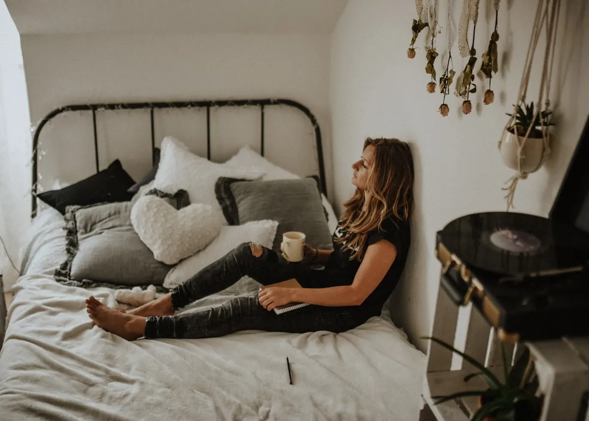 Person sitting on bed experiencing morning-after anxiety in Los Angeles