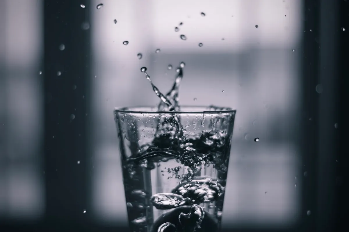 Water pouring into a glass representing fast rehydration methods in Los Angeles